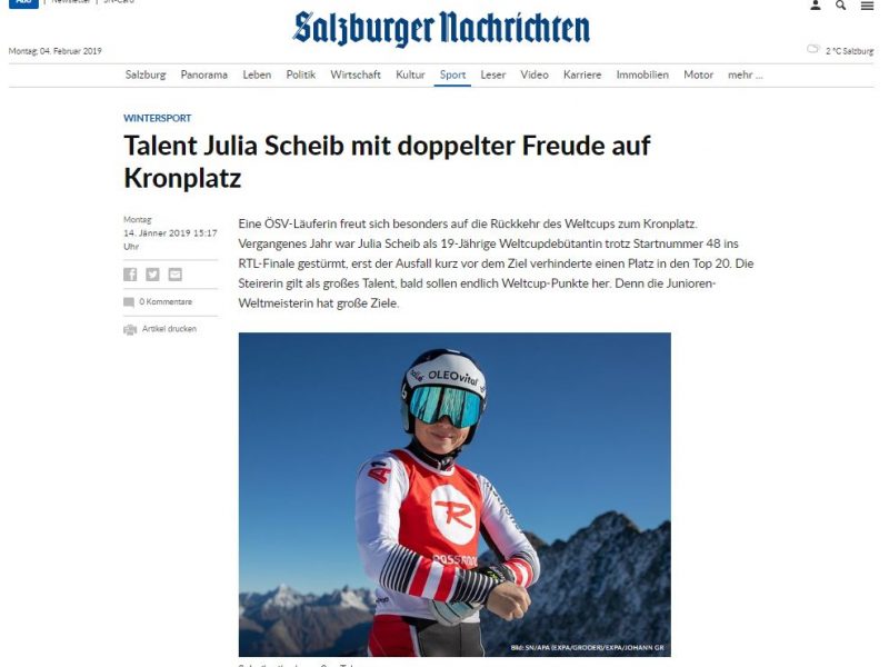 Bild zeigt die Österreicherin Julia Scheib vor einer Bergkette stehend